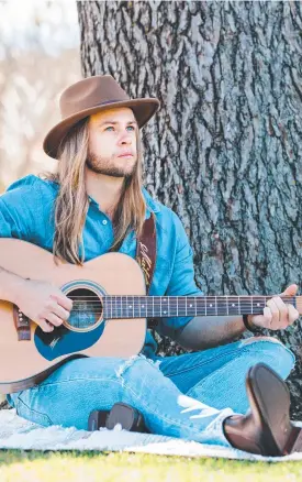  ??  ?? IN SEASON: musician Ethan Bielefeld shows off his spring fashion picks, wearing a Universal outfit and R.M. Williams boots.