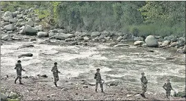  ?? REUTERS ?? BSF soldiers patrol near the Line of Control at Sabjiyan sector of Poonch district.