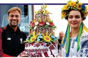  ?? GETTY IMAGES ?? Flower power: Jurgen Klopp is greeted at Kiev airport with a cake, but many fans are anxious about making it to Ukraine
