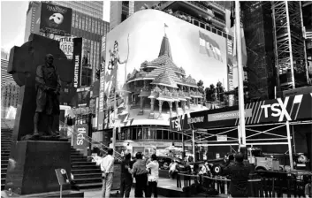  ?? AP PHOTO/TED SHAFFREY ?? Imagery of the Hindu deity Ram and 3-D portraits of the proposed Hindu temple are displayed on a digital billboard in Times Square, on Wednesday to celebrate the groundbrea­king ceremony of a temple dedicated to the Hindu god Ram by Indian Prime Minister Narendra Modi in Ayodhya, in New Delhi, India.