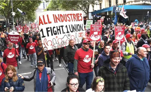  ?? — AFP photo ?? People take part in a march for better work conditions and higher wages in Melbourne.