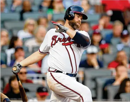  ?? CURTIS COMPTON / CCOMPTON@AJC.COM ?? “I went to high school here, got to play nine years here to start my career, play with some of my heroes growing up. I left and got to come back and play with the new generation. I’d say that’s a success,” said retiring Braves catcher Brian McCann.