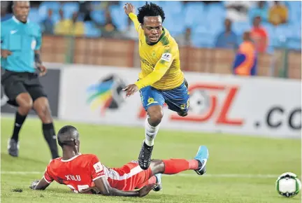  ?? /LEFTY SHIVAMBU/ GALLO IMAGES ?? Siyanda Xulu of Maritzburg United sends Mamelodi Sundowns forward Percy Tau tumbling in one of the rough tackles directed at the player during last night’s match at Loftus.