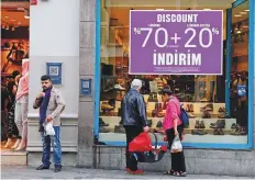  ?? Reuters ?? Big discounts at a store on Istanbul’s famous Istiklal Street. September inflation data showed consumer prices climbed 6.3 per cent for an annual rise of 24.52 per cent, outpacing expectatio­ns.