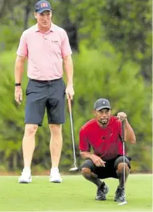  ??  ?? VICTORIOUS Peyton Manning (left) and Tiger Woods held off a formidable team.