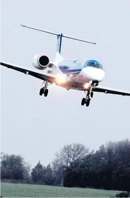  ??  ?? A jet lands at Edinburgh Airport as noise row escalates.