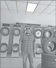  ?? HERALD photo/carrie Harvell ?? Ray Jones, Manager at Franklin and Sons, is pictured inside Franklin and Sons near a display of tires. Franklin and Sons has been serving West Texas since 1961.