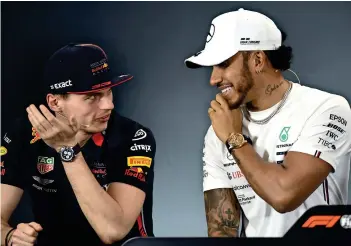  ?? AFP file ?? IN DISCUSSION: Lewis Hamilton (right) is shares a thought with Max Verstappen in Melbourne. -