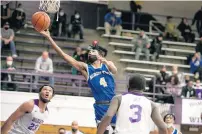  ?? ?? Bloom’s Jordan Brown extends toward the basket against Thornton.