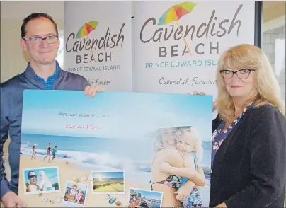  ?? MITCH MACDONALD/THE GUARDIAN ?? Kevin Champion of Tourism Cavendish Beach and president Sandi Lowther hold up one of the promotiona­l posters for the group’s 2017 marketing plan that was unveiled during the group’s spring general meeting Tuesday night. The group is aiming to...