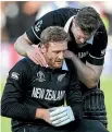  ?? ?? Martin Guptill, left, is consoled by Jimmy Neesham after the World Cup one-day final loss to England.