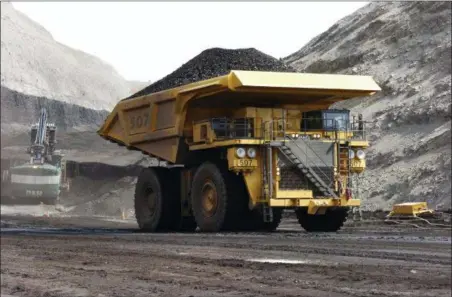  ?? MATTHEW BROWN — THE ASSOCIATED PRESS FILE ?? In this file photo, a mining dumper truck hauls coal at Cloud Peak Energy’s Spring Creek strip mine near Decker, Mont. The Trump administra­tion is considerin­g using West Coast military bases or other federal properties as transit points for shipments of U.S. coal and natural gas to Asia.