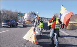  ?? CLAUDE PARIS/ASSOCIATED PRESS ?? French Prime Minister Edouard Philippe announced a suspension of fuel tax hikes Tuesday, a major U-turn to appease protesters.