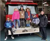  ?? Photos by Matthew Liebenberg/Prairie Post ?? The Fire Chief for a Day contest winners at the Swift Current Fire Hall, Nov. 3. From left to right, Bennet Gramyk, Scarlet Unger, Hudson Johnston, Xander Lemire, Oneddie Marayayong, and Deputy Fire Chief Pete L'Heureux.