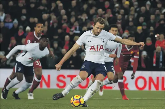  ?? Reuters ?? Missing from the spot in the 87th minute, Harry Kane converted when given a second chance in extra time to lift Tottenham to 2-2 draw with Liverpool