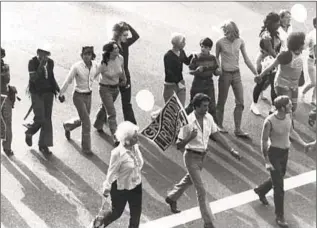  ?? USC Libraries ?? MEMBERS of the Gay Liberation Front march in the f irst L. A. Pride parade on June 28, 1970, just two days after a judge overruled the L. A. Police Commission, which had denied a permit.