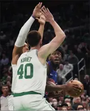  ?? CHARLES KRUPA — THE ASSOCIATED PRESS ?? Detroit Pistons center James Wiseman, right, is trapped by Boston Celtics center Luke Kornet (40) on a drive to the basket during the first half, Wednesday in Boston.