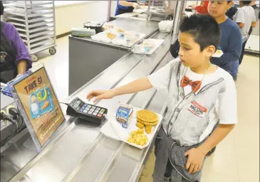  ?? Hearst Connecticu­t Media file photo ?? Many wealthy Connecticu­t towns choose to opt out of the National School Lunch Program — and its strict standards and requiremen­ts — to offer more enticing options for students.