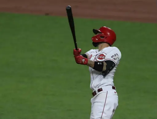  ?? Associated Press ?? Cincinnati Reds right fielder Nicholas Castellano­s watches as he hits a three-run home run in the seventh inning Friday night against the Pirates at Great American Ball Park in Cincinnati.