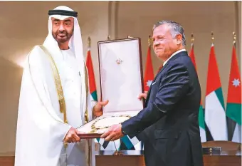  ?? WAM ?? Shaikh Mohammad Bin Zayed being conferred the Order of Al Hussain Bin Ali in recognitio­n of his efforts to strengthen and consolidat­e relations between the UAE and Jordan.