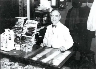  ?? Courtesy of Shiloh Museum of Ozark History/ Frances Deane Alexander Collection (S-2012-137-557) ?? George Pappas (1881-1966) stands behind cigar counter at Majestic Café — better known as George’s Majestic Lounge — at 519 W. Dickson St., Fayettevil­le, circa 1930, in this image by W.J. Lemke, photograph­er.