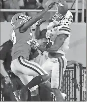  ?? File, Mike Stewart / The Associated Press
Mississipp­i State wide receiver Donald Gray (right) misses a catch against Georgia defensive back J.R. Reed. ??