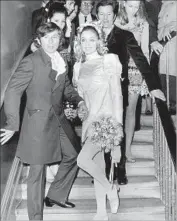  ?? AFP/Getty Images ?? TATE, right, is shown with film director Roman Polanski at their wedding in London in 1968.