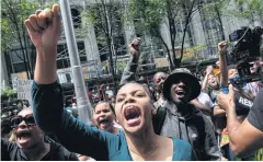  ?? AFP ?? Dylan Rooke of Hazelwood joins more than 200 people at the Allegheny County Courthouse on Thursday in Pittsburgh for a rally to protest against the shooting of a black teen.