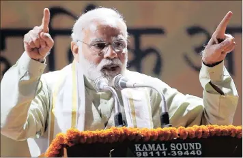  ?? PHOTO: REUTERS ?? India’s Prime Minister Narendra Modi addresses supporters in New Delhi, India. The PM swept into power three years ago with his promise to lead India into an age of modernity and developmen­t.