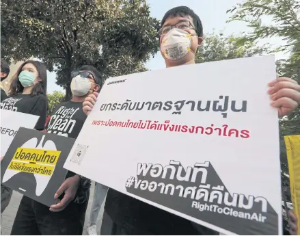  ?? CHANAT KATANYU ?? Activists from various organisati­ons including Greenpeace, BioThai and the Foundation for Consumers, gather at the government’s centre to accept petitions to call for more efficient measures to combat haze which hits the country at this time of the year.