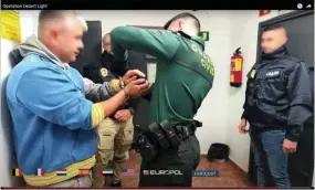  ?? (AFP) ?? This video grab taken from a footage released yesterday by Europol shows Spanish Guardia Civil Police detaining suspects in an undisclose­d place in Spain as part of a drug traffickin­g investigat­ion.