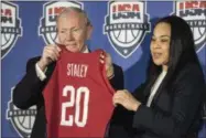  ?? SEAN RAYFORD — THE ASSOCIATED PRESS ?? South Carolina women’s head basketball coach Dawn Staley, right, receives a jersey from USA Basketball Chairman Gen. Martin Dempsey, left, during a press conference at Williams Brice Stadium Friday in Columbia, S.C. Staley has been named the women’s...