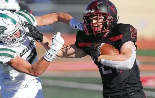  ?? Photos by Tom Reel / Staff photograph­er ?? New Braunfels Canyon running back Micah Williford, who had 44 yards rushing and 88 yards receiving with a touchdown, battles a Cedar Park tackler on a run Thursday.