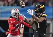  ?? SAM HODDE — GETTY IMAGES ?? Missouri's Theo Wease Jr. (1) catches a pass against Ohio State's Jordan Hancock (7) for a first down during the fourth quarter in the Goodyear Cotton Bowl at AT&T Stadium on Friday in Arlington, Texas.