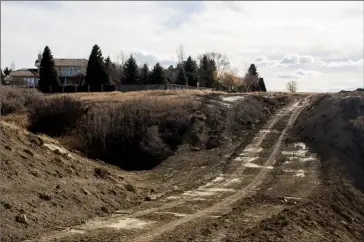  ?? Herald photo by Greg Bobinec ?? A number of residents in the Tudor subdivisio­n have raised concerns about the land developmen­t between the homes and the coulees that was supposed to be completed before Jan 30, 2019.