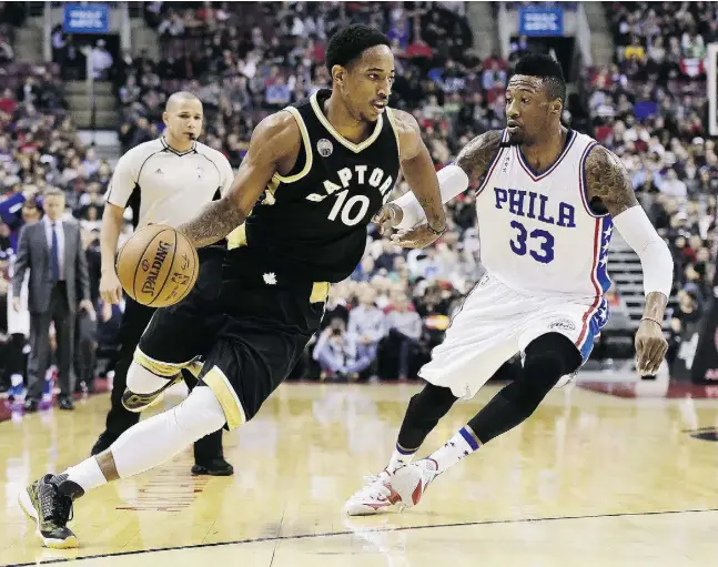 ?? Frank Gun / THE CANADIAN PRESS ?? The Raptors’ DeMar DeRozan put up 25 points on Robert Covington, right, and the 76ers on Sunday in Toronto, for the team’s fourth win in a row.