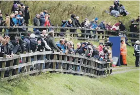  ?? ?? The spectators braved the elements on Sunday to watch the Gold Cup at Oliver’s Mount