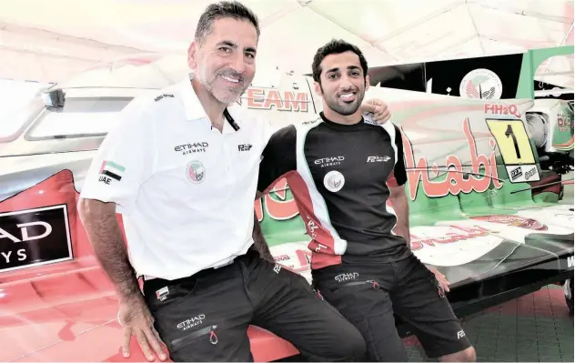  ??  ?? ↑
Under the guidance of Guido Cappellini (left), Rashed Al Qemzi tries for a third UIM F2 triumph in five years.
