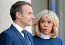  ?? AP ?? A new book says Emmanuel and Brigitte Macron’s public relations adviser tracked down the source of homosexual­ity rumours about the French president.