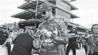  ?? Michael Conroy / Associated Press ?? Alex Rossi, a former reality television show contestant on “The Amazing Race,” was a surprise winner in the 2016 Indy 500. Rossi and close friend Conor Daly are starting on the last row.