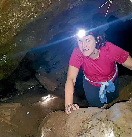  ?? PHOTOS: ELIZABETH BEAN ?? ‘‘You can either peer down into the cave, or if you can don't mind confined spaces and muddy surfaces, venture in.’’ The writer ventures out of the Maitai Caves.