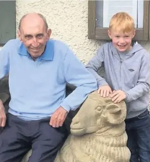  ??  ?? Eddie Thompson with his grandad, Colin, in whose memory he will take on a 5k Pretty Mudder challenge to raise money for Cancer Research