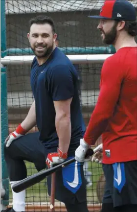  ?? ROSS D. FRANKLIN — THE ASSOCIATED PRESS ?? Indians second baseman Jason Kipnis talks with center fielder Tyler Naquin as the two wait their turn for batting practice Feb. 16 in Goodyear, Ariz.