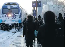  ?? ALLEN McINNIS ?? People line the platform to board a St. Jerome-bound RTM train after some trains were cancelled at the Lucien L’Allier station on Monday.