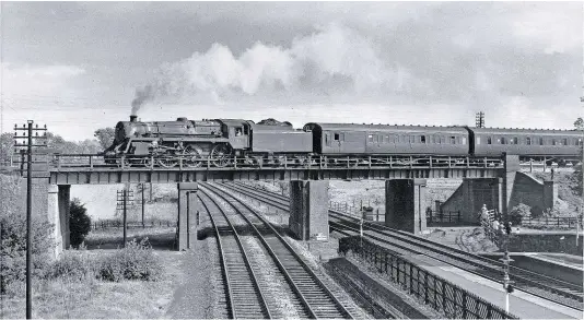  ?? T.G. HEPBURN/ RAIL ARCHIVE STEPHENSON ?? BR Standard ‘5MT’ No. 73010 crosses the Midland Main Line at Loughborou­gh on the Great Central bridge in the summer of 1963. By this time, the writing was already on the wall for the latter and the bridge was demolished in 1980. This picture is taken from a road bridge across the Midland, which is still there. It’s going to be a popular spot in the future!