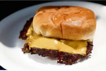  ?? — Photos: TNS ?? The Smash Burger is a double cheeseburg­er with ketchup, mustard, pickle and onion.