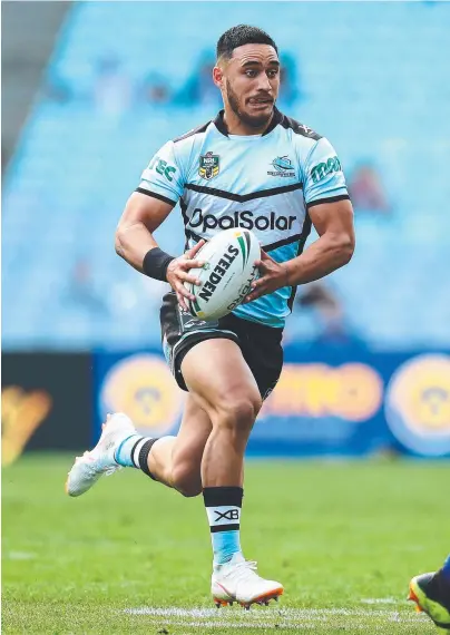  ?? HOT FORM: Cronulla's Valentine Holmes makes a break to set up a try for teammate Sosaia Feki yesterday. ??