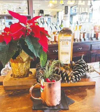  ?? THE LIBERTY DISTILLERY ?? At The Liberty Distillery, the Yule Mule is a festive update of a classic Moscow Mule, made with lime and cranberry juices and ginger beer, garnished with rosemary, cranberrie­s and a candy cane.