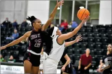  ?? ELLIOTT PORTILLO — CAL POLY HUMBOLDT ?? Humboldt point guard Devon Lewis has her shot contested during the first game against Chico State in December. The ‘Jacks lost 79-66to the Wildcats in the rematch on Saturday.