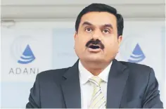  ??  ?? This file photo shows chairman of the Adani Group Gautam Adani speaking during a press conference in Ahmedabad. Indian mining giant Adani on June 6, said it would go ahead with a huge US$16 billion coal project near Australia’s Great Barrier Reef that...